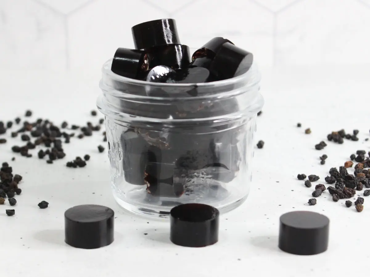 clear glass jar of homemade elderberry gummies