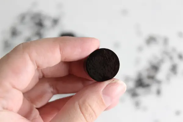 woman's hand holding a homemade elderberry gummy