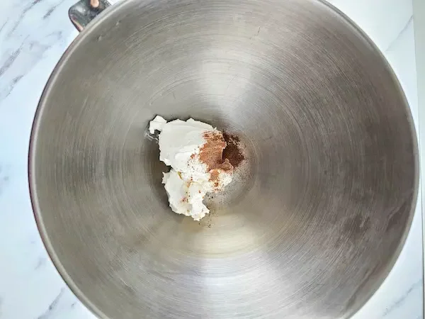 mixer bowl with homemade body butter in it and gingerbread spices