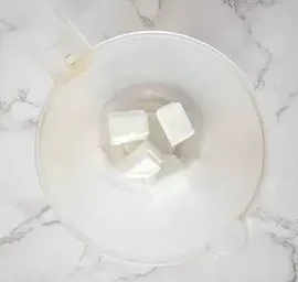 measuring cup with 4 cubes of melt and pour soap base