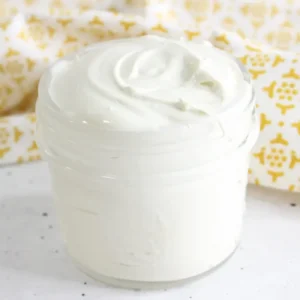 jar of homemade diaper rash cream with a yellow background