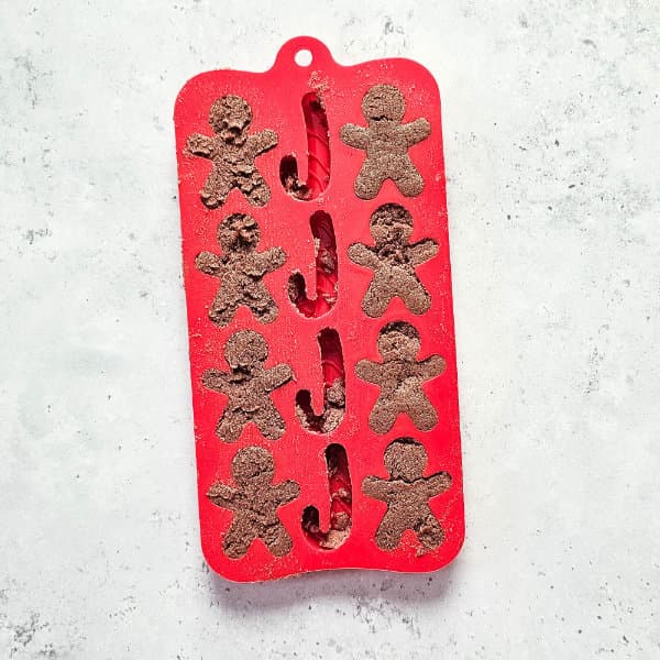 silicone mold of gingerbread men filled with shower bomb mixture 