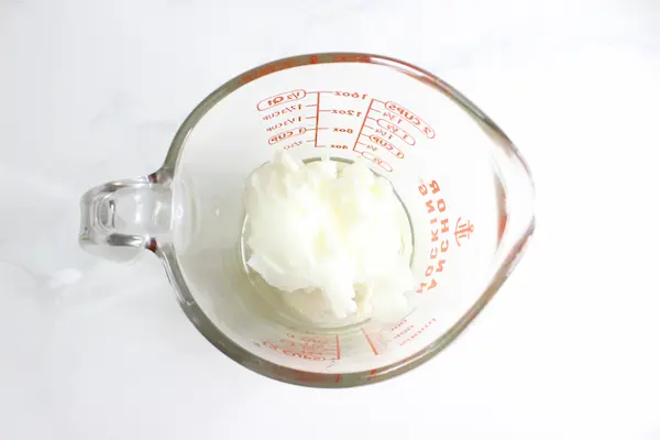 tallow in a glass measuring cup