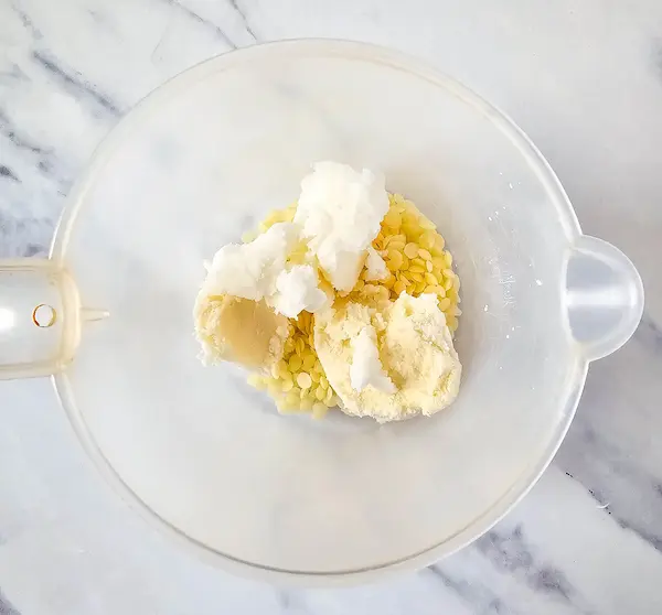 bowl of natural butters and oils before melting down to make gingerbread lotion bars