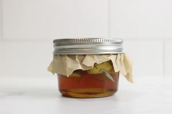 sealed mason jar of homemade herb infused honey
