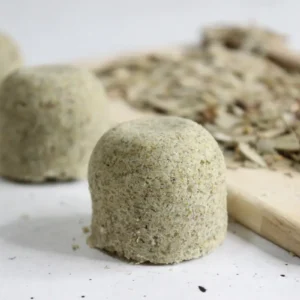 homemade eucalyptus shower steamers with dried eucalyptus on wood