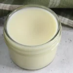glass jar of homemade beard balm from a natural diy recipe