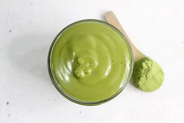 top view of a jar of homemade green tea face cream