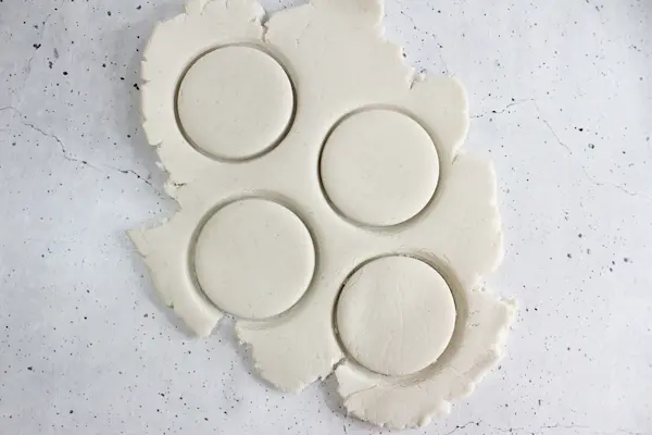 no bake diffuser ornament dough rolled out with round shapes cut into it