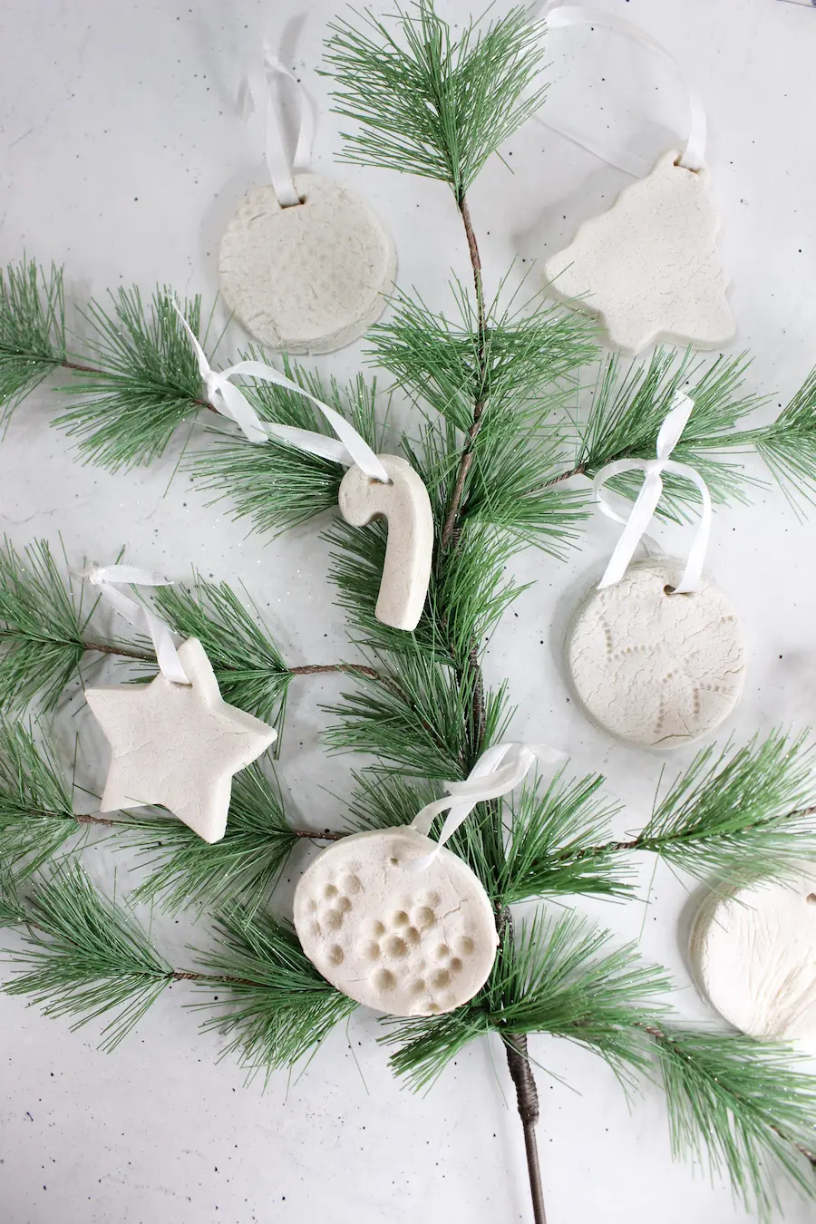 no bake homemade essential oil diffuser ornaments on Christmas tree greenery