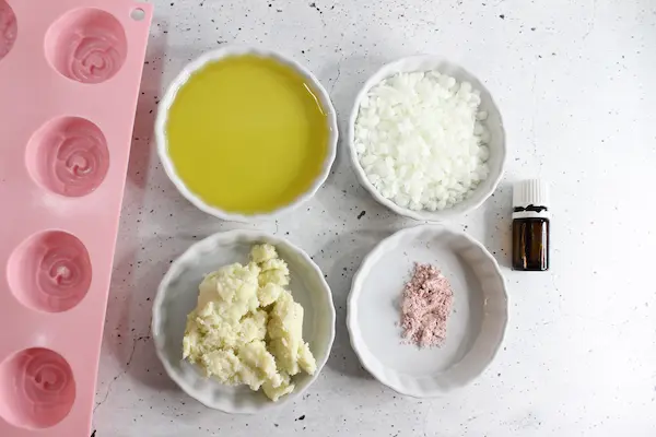 Moisturizing Rose Lotion Bars DIY Recipe 13 bowls of ingredients and essential oil needed to make rose lotion bars