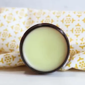 tub of homemade lemon balm lip balm