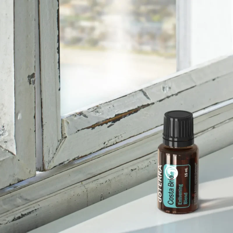 bottle of doterra costa brio on rustic window ledge
