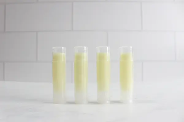 tubes of cooled homemade tallow lip balm with the caps on
