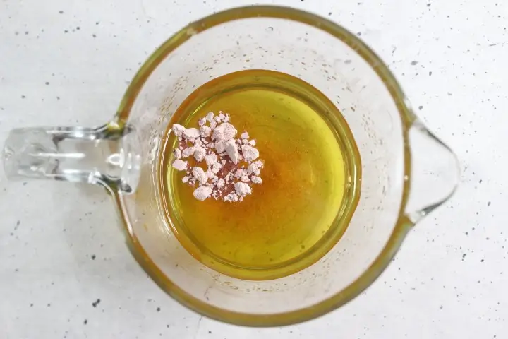 Moisturizing Rose Lotion Bars DIY Recipe 20 adding rose clay to melted oils and butters for coloring diy rose lotion bars