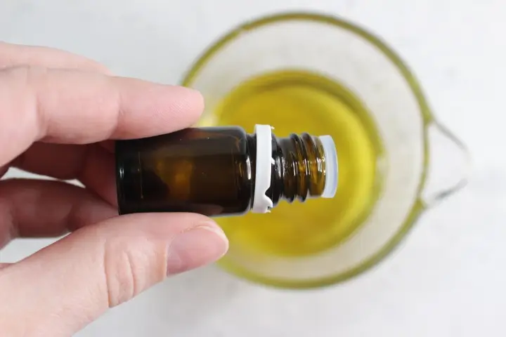 Moisturizing Rose Lotion Bars DIY Recipe 21 adding essential oil to melted waxes and butters for making diy rose lotion bars