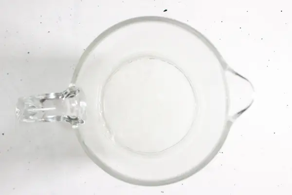 Magnesium Tallow Lotion Balm DIY Recipe 19 glass measuring cup of melted tallow and beeswax for making magnesium tallow balm