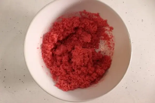 a bowl of red sugar scrub