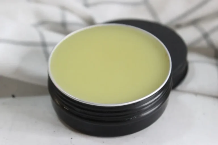tin of homemade headache salve