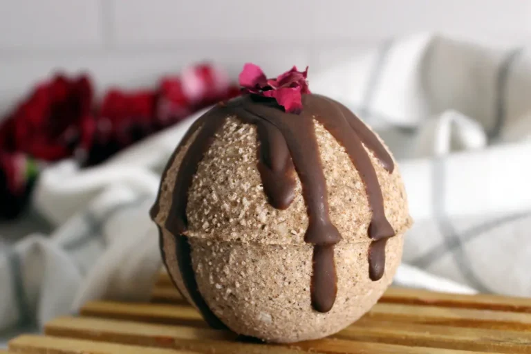 homemade chocolate rose bath bomb on wooden pedestal