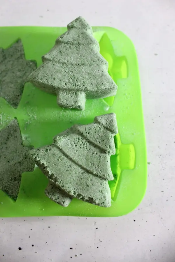 Charming Christmas Tree Bath Bombs Recipe 24 Handmade Christmas Tree bath bombs sitting on top of the silicone mold