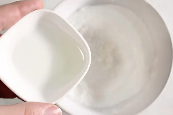 Charming Christmas Tree Bath Bombs Recipe 17 adding oils to ingredients for making homemade Christmas Tree Bath Bombs