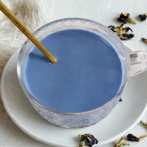 Blue Moon Milk Recipe with Butterfly Pea Flower and Ashwagandha For Sleep and Stress 25 glass teacup of blue moon milk made from butterfly pea flower