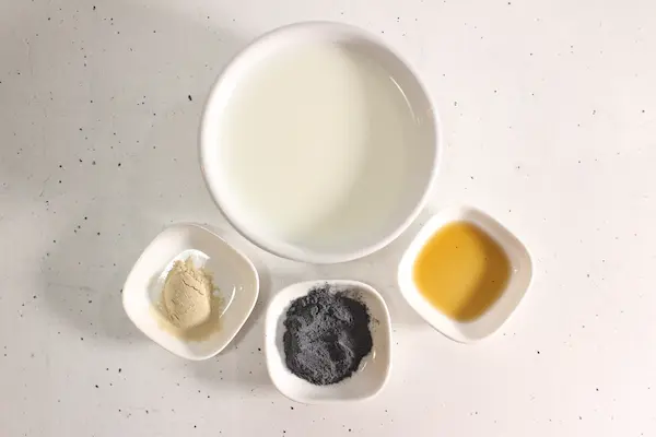 Blue Moon Milk Recipe with Butterfly Pea Flower and Ashwagandha For Sleep and Stress 13 bowls of ingredients needed to make blue moon milk with butterfly pea flower