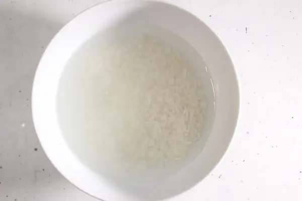DIY Rice Face Mask for Glass Skin 20 a bowl of rice soaking in water