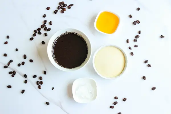 Under Eye Coffee Patches DIY Recipe 13 bowls of ingredients to make diy coffee eye patches with some coffee beans scattered around