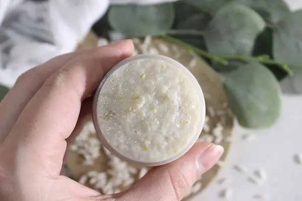 DIY Rice Face Mask for Glass Skin 24 a woman's hand holding a jar of diy rice face mask