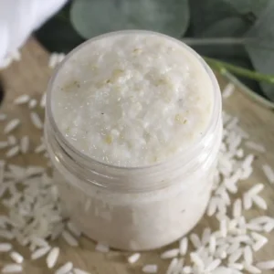 DIY Rice Face Mask for Glass Skin 25 jar of diy rice face mask on wood with rice scattered around