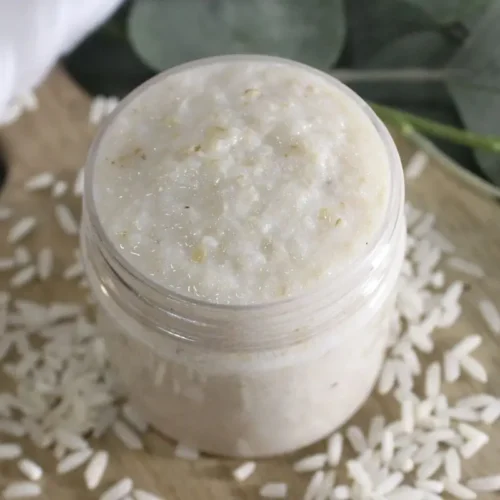 DIY Rice Face Mask for Glass Skin 24 jar of diy rice face mask on wood with rice scattered around