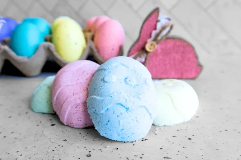 homemade easter bunny bath bombs with Easter eggs decorations in the background