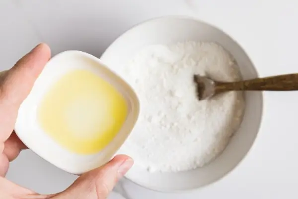 Easter Egg Bath Bombs Recipe 16 bowls of ingredients being combined to make Easter egg bath bombs