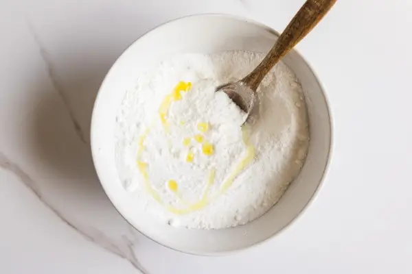 Easter Egg Bath Bombs Recipe 15 a bowl of dry ingredients and oils to make easter egg bath bombs