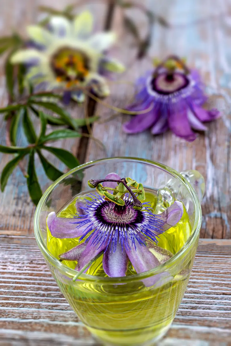 Calming Bedtime Tea Recipes For Sleep 17 glass mug of tea with passion flowers